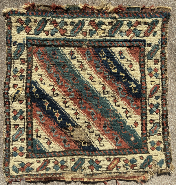 North-west Persian pile khorjin face, 51 x 49 cm, good age and colours including a nice “petrol” blue-green; condition issues evident from the image. Email: peparethos@xsmail.com
