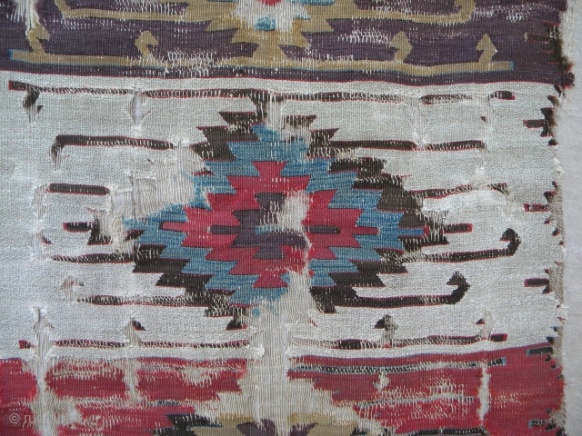 Anatolian kilim fragment with considerable age, probably early 19th century, as mounted, 179 x 166cm; the fragment itself: 156 x 140cm.            