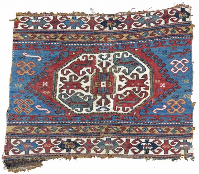 This energetically drawn sumak end panel was woven in the Moghan region of the Caucasus. A central octagon is traced with rams' horn motif, extending from both the top and bottom across  ...