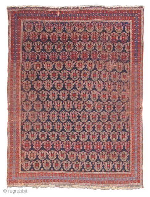 Afshar rug, mid 19th cen. Woven like a fine textile, this classic Afshar rug draws rows of radiant 'boteh' paisleys against a deep indigo ground. The delicate border is comprised of thin  ...