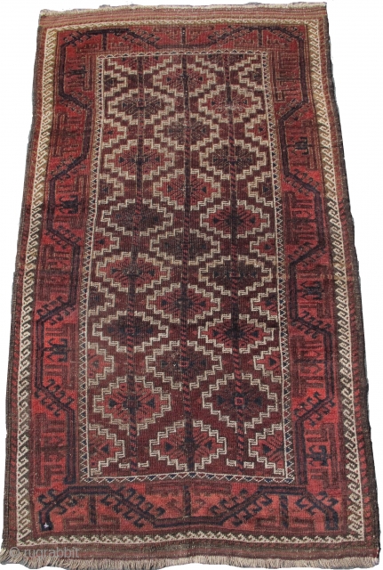 aubergine ground Baluch rug with an asmalyk design field, 3'0"x5'0"                       