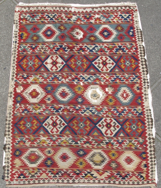 Shirvan Kilim, good age, colorful and graphic with a particularly good use of white.

This piece is lightly mounted and conserved against a white cloth.
size is 5'10"x8'0"       