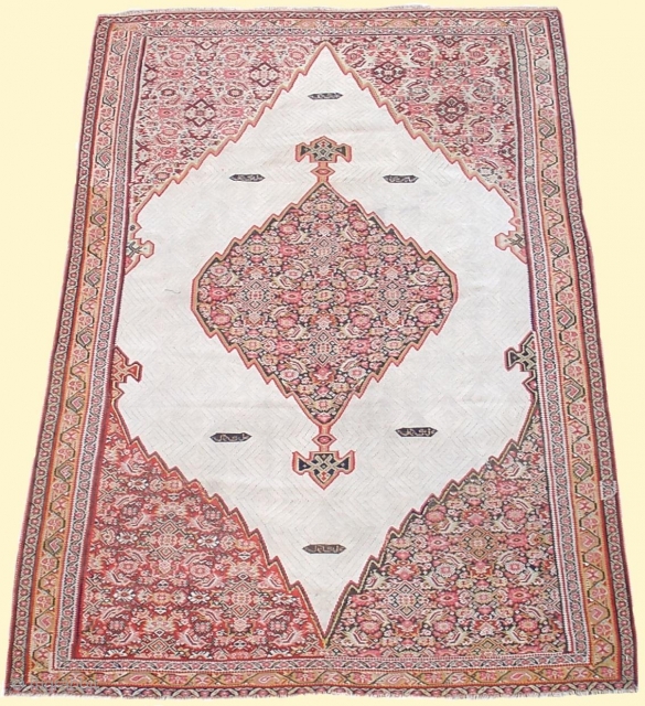 Exceptionally Fine Elegant Senneh Kilim, Western Persia, 3rd quarter of the 19th century. 4'1" x 6'4". 
While the medallion and corner-pieces layout is a well known type, the execution and quality of  ...