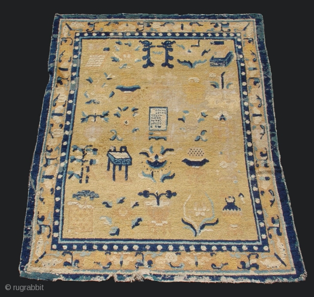 Chinese Ningxia Scholar's Rug with dragons, an inscribed tablet, incense burner, plants, ceramics and other symbolic accoutriments. First half of the 18th century. scattered antique repairs. 4'6" x 6'5" , inv#5653_S  