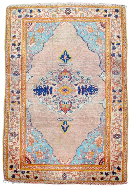 This elegant antique Tabriz mat faithfully reproduces in miniaturized format a formal nineteenth century Persian medallion design with fine detailing of floral elements including exceptionally drawn quartered blossoms in the corner pieces.  ...