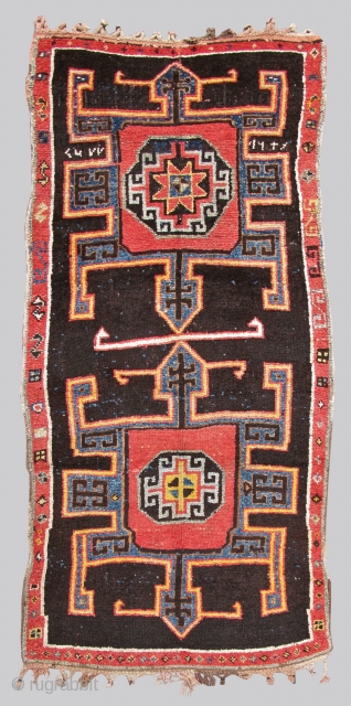 This bold village rug employs soft wool and a rustic weave. Representing design features from the related border areas of eastern Anatolia, the Caucasus, and northwest Persia, this piece was most probably  ...