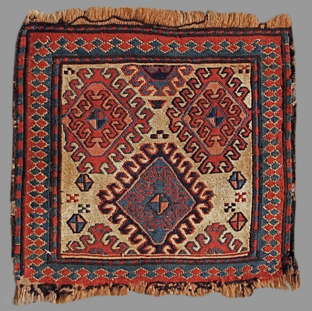 Shasevan Soumac Bagface with a colorful large-scale latch-hook design drawn against a small white ground canvas. 

size is 1'2"x1'2"

Inv#     15170
         
