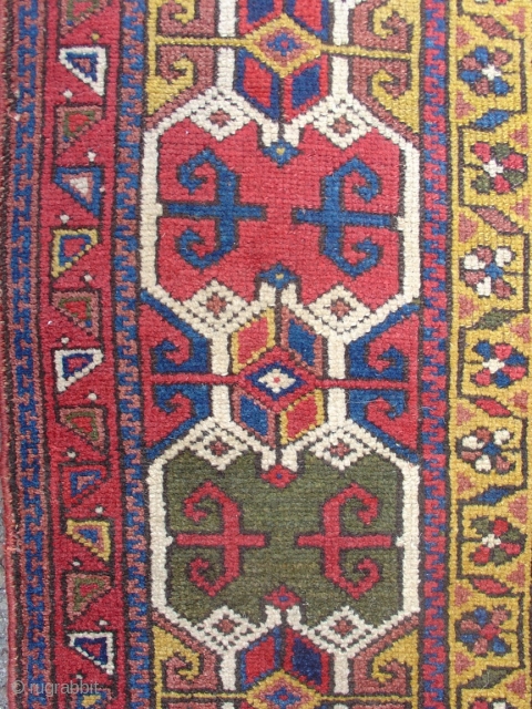 Northwest Persian Kurdish long rug with a very graphic geometric border and floral field. Size = 3'6" x 10'3". Inv. # 14834.           