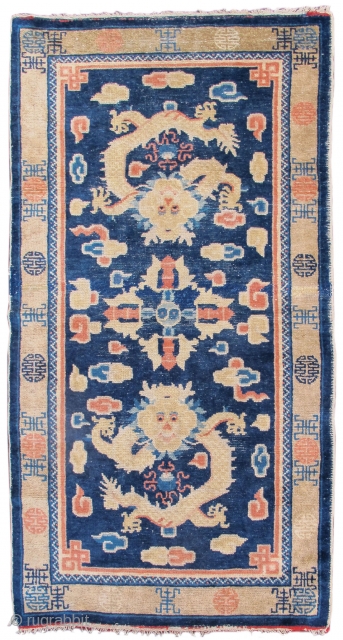 Ningxia / Ning Hsia rug with two dragons and a vajra in the field. "Shu" sign border. Late 19th century.             