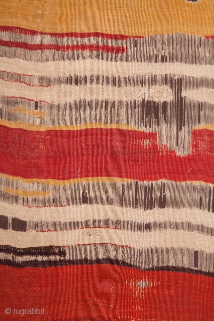 A rare, 18th century kilim. Probably woven in Cappadocia. Minimal and bold with wonderful dyes. Notice the masterful use of three different reds in the middle stripes. Blacks almost completely corroded. Expertly  ...