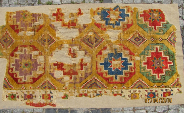 

Central Anatolian rug fragment C. 1800. Approximately 94x177cms. Museum quality mounting.                      