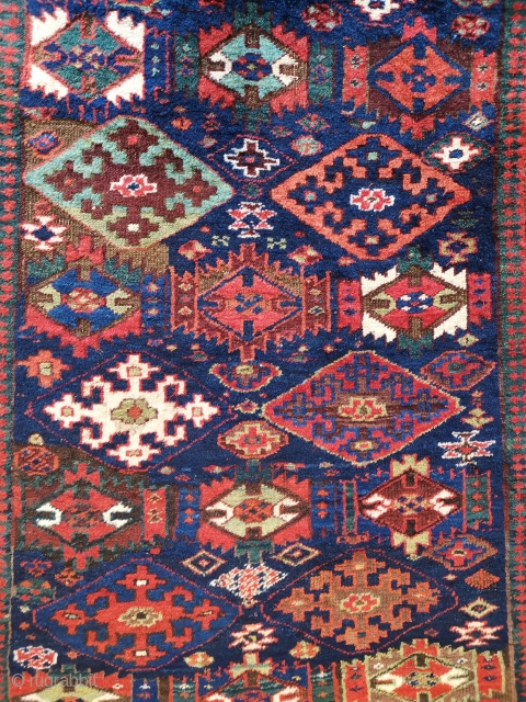 Kurdish rug of unknown origin. I would be happy to hear views. It has some obvious Sauj Bulagh design elements but otherwise is not typical. A beautiful wonky tribal piece with heavy  ...