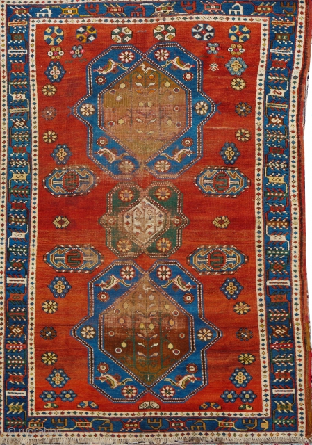 Antique Kazak 200x137cm
Material:	Wool on wool
Manufacturing period:	1850-1899
Country:	Iran
Condition:	Overall in fair condition with traces of ageing and usage and low pile 

This rare and unique handmade all-wool red-ground Caucasian Lambalo Kazak dates to the second  ...