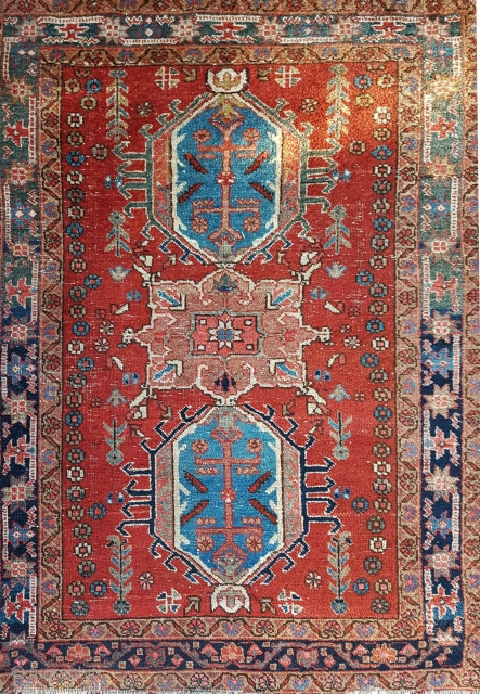 This is a 1900s Karajah 130x95 cm or 4.3x3.1 feet in overall OK condition with traces of use and age. Note some wool discoloratio around the border 

     