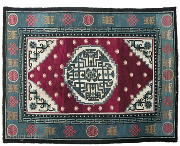 R-0966
Antique Tibetan large area carpet with a central floral medallion and floral corner cartouche motif in white and shades of indigo against a wine red field with "frog's feet" motifs. The central  ...