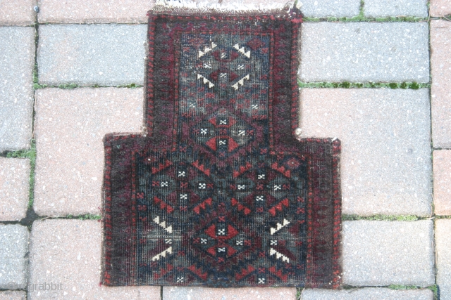 A 1'2"x1'4" Baluch saltbag Ca.1900, rare pile on two sides, corroded  blacks in the field.                 