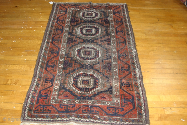 An Antique four medallion Baluch. Good colors, general wear, a couple holes. very reasonably priced.                  