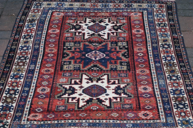 A 3'8"x5'19th.century lesghi rug in nearly perfect condition. featuring all natural dyes and lusterous wool. With a handle like a handkerchief.            