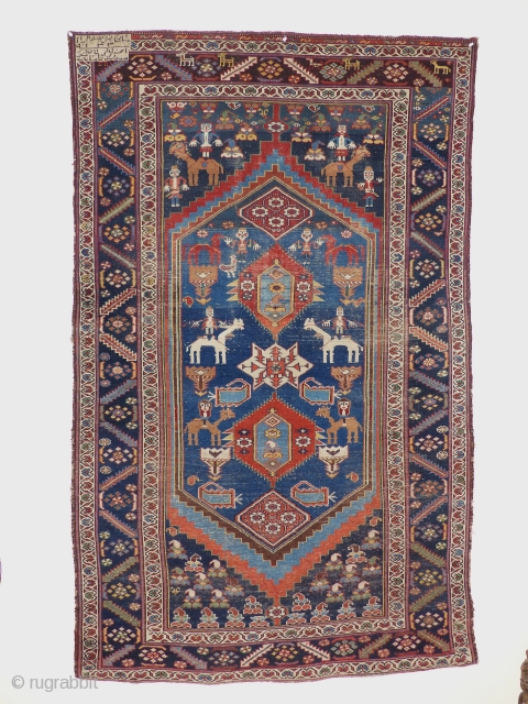 A nomadica Bakhtiari Rug,circa 1900 jh,Beautiful Colours,animals,flowers and other tribal motife.
midfield has low pile,original ends and sides,no repair.
size; 205x123 cm             