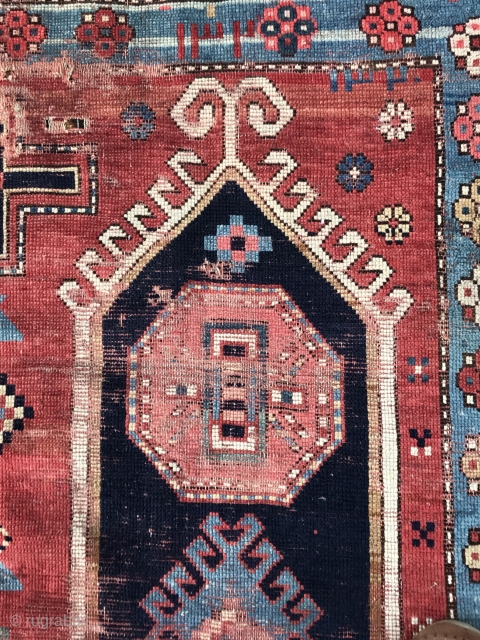 Caucasian village rug fragment dated Hijri 132_  (as early as 1902) three female figures in center. A graphic piece, worn and challenged condition with holes and losses. 48” x 73”  