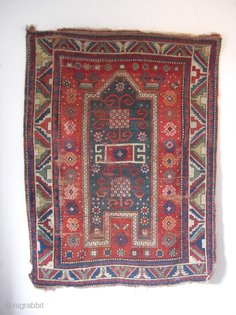 An antique Kazak prayer rug with the size 162 X 105 cm. Open sides, used parts. No repairs, no tinting, no cut. Good colors.         