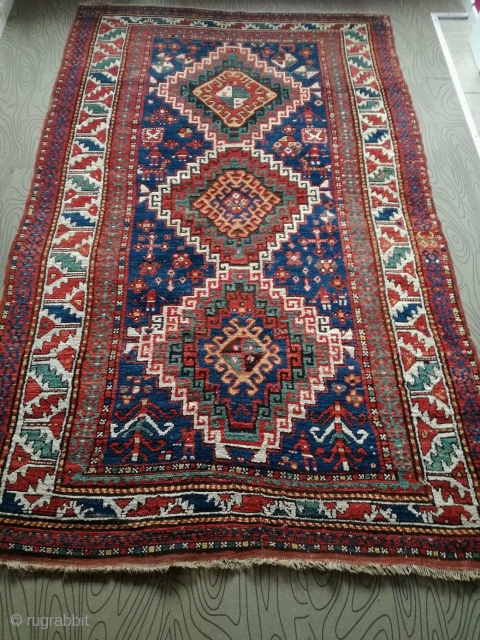 An antique Kazak rug. All natural dyes. 220/134 cm. Signs of use but good shape. All endings original. No repairs.             