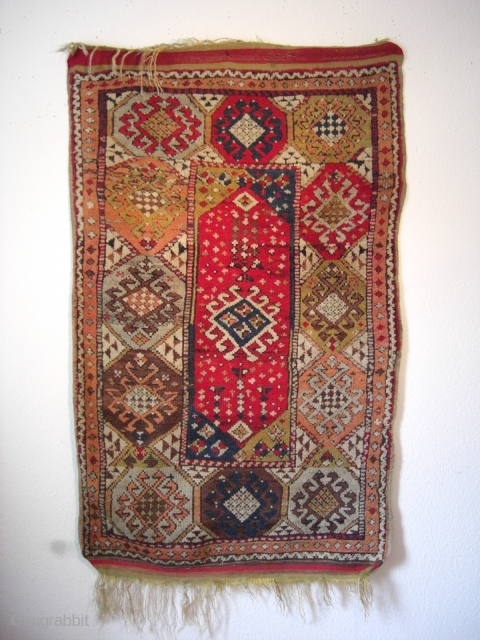 An antique Anatolian village rug. 156 X 98 cm. Good shape with no repairs, no cuts, all original sides with kilim endings.           