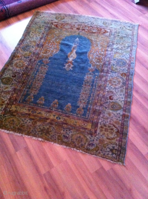 An old turkish or probably North persian prayer rug with the size 155/125 cm. Good shape with reduced endings. Part silk frings.           