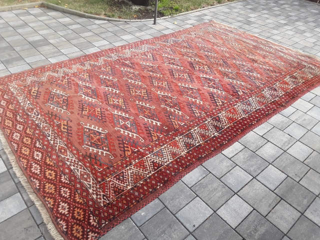 An old or antique Yomud Turkmen carpet with 354/200 cm. Good shape for its age with smallest repiles. Original endings on the long sides and kilim on one side.    