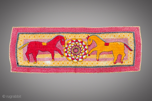 C. 1900 - 1920 
Kantha with an exceptional showcase of colorful embroidery featuring central mandala and stand out horses with a clean hand-sewn quilted border with colored edges.
Size : 21 by 8  ...