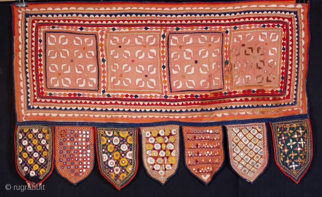 • TORAN •
'Embroidered door hanging'

One of the best and rare example of Sodha Rajput embroidery. It has all the elements of Sodha Rajput embroidery technique which includes pakko, kharek, aabhla, bhavariyo, satin  ...