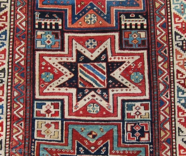 Late 19th c. Gendje, 3'8" x 9'1".  A very attractive long rug featuring lovely stars and animals in very good condition.           