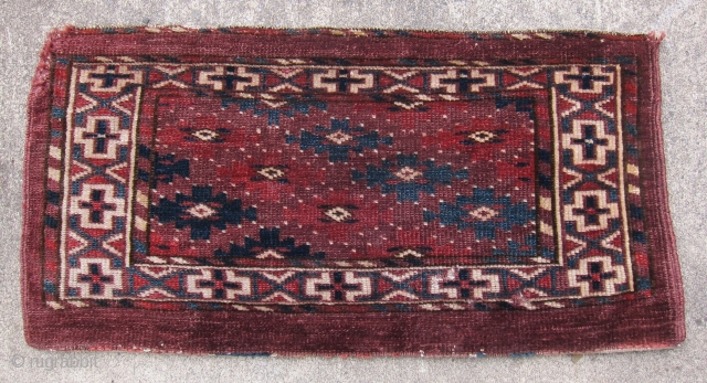 Yomud mafrash, circa 1875, 12" x 24".  Natural dyes, symmetrical knotting, lustrous wool.  Pieces showing this design are usually attributed to the Yomud Igdyr subtribe, and are relatively rare.   ...