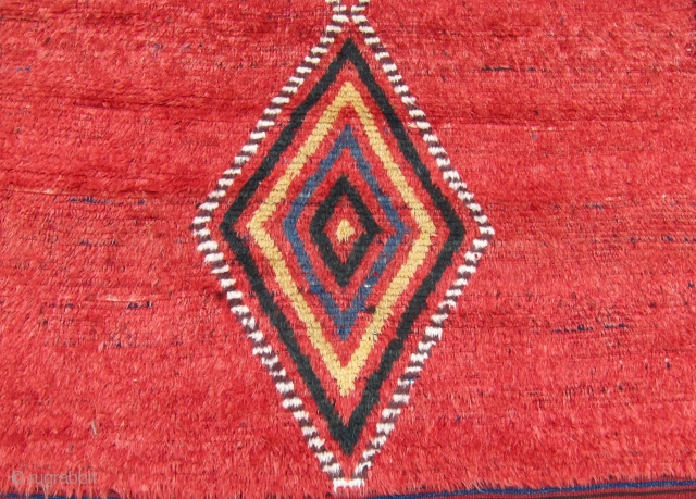 One of 6 dramatic and colorful sleeping rugs purchased from Baluchi tribesmen living in the area between Quetta and Kandahar. The rug measures 47" x 69".  The wool is long and  ...