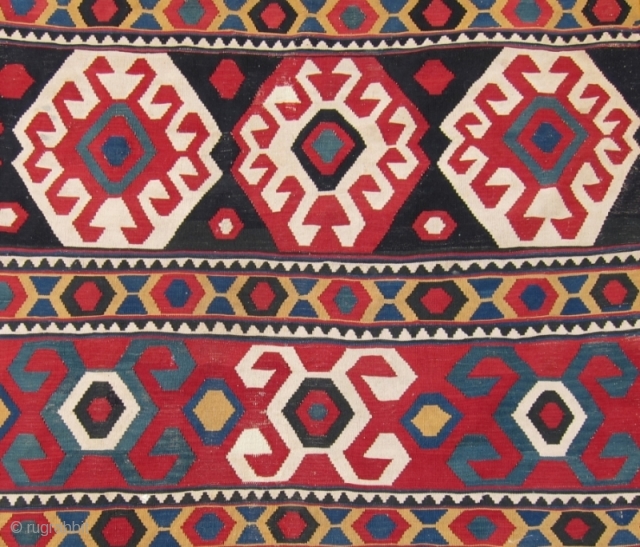 Zangadzor Region Kilim, S. Caucasus,  5'9" x 8'11".  A strikingly beautiful kilim with intense rich colors. There is a sleeve on the back for hanging. Minor restoration along the edges.  ...