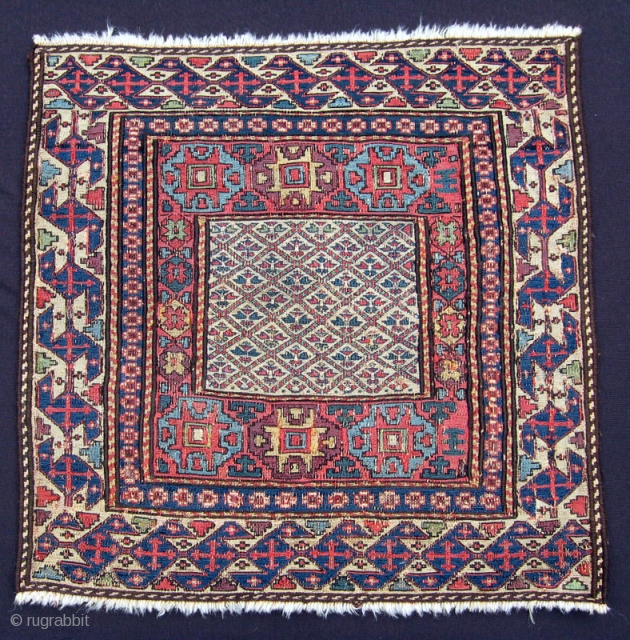 Shahsavan sumak bagface, 3rd Qtr. 19th C., 21" x 22".  Am unaware of a published example of a Shahsavan sumak bag featuring this field design. Barber pole side borders are not  ...