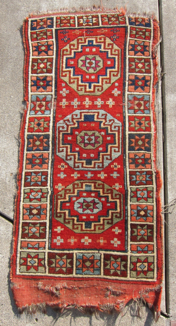 19th C. Karaman yastik, 40" x 19". The drawing, range and wonderful quality of the colors suggest significant age. As shown, the side cords have suffered, but the pile ...