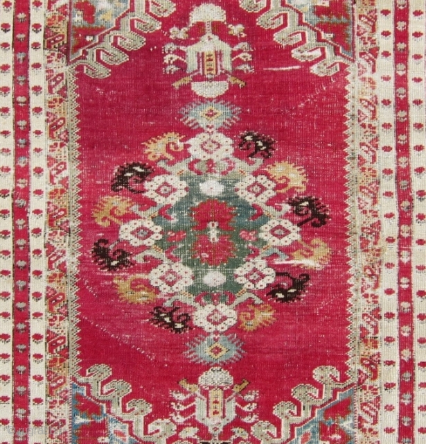 2nd half 19th c. Turkish Kirshehir rug, 44" x 88".  Lovely narrow borders surrounding a richly decorated central bouquet of flowers.           