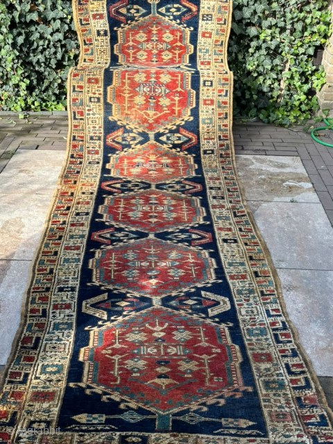 Vintage Azerbaijani Runner Rug – 360 × 103 cm

Beautiful vintage runner rug from Azerbaijan, featuring a striking traditional geometric design. The rug has a deep navy blue field with a sequence of  ...