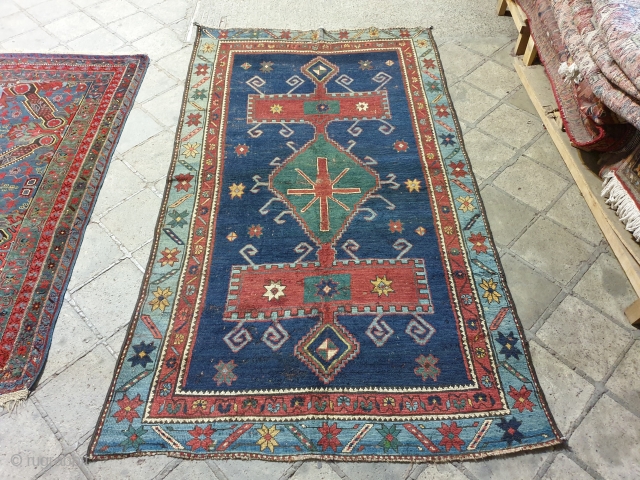 Kazak,knotted rug with symmetrical design,indigo blue on field,in good condition ,wool foundation                     