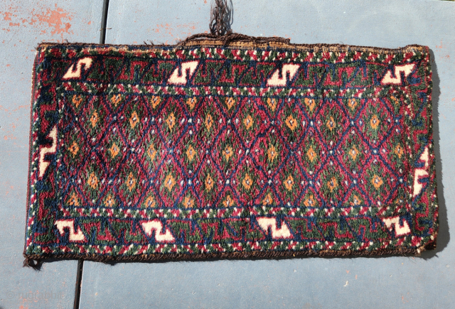 Baluch balisht pillow bag, early 20c and in m.i.n.t. condition! 

Measuring 78x40cm, this striking bag has full pile with natural dyes and soft wool. Kilim ends and original back. Goathair selvedge and  ...