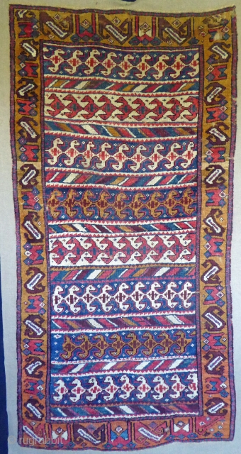 1534 North West Persian carpet, mid nineteenth century, 6'0 x 2'11, 183 x 89
wide range of brilliant natural colours.  Mounted on fabric, some small holes but generally good pile   