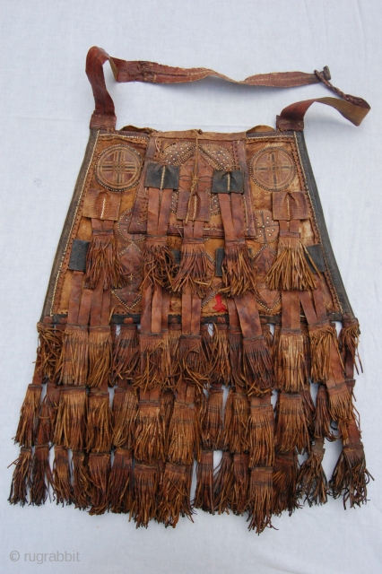Antique tribal Malinese Touareq conical shaped leather bag. 46/33 x 30 cm (1ft 6"/1ft 1" x 1ft). Condition: good, original sides and back complete and intact, original leather tassels complete and intact,  ...