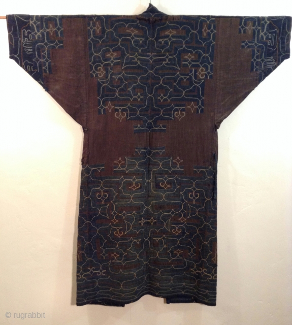 This robe was made by the indigenous people living on the northern most island of Japan. Both men and women wore these robes which are a form of appliche. the blue cotton  ...