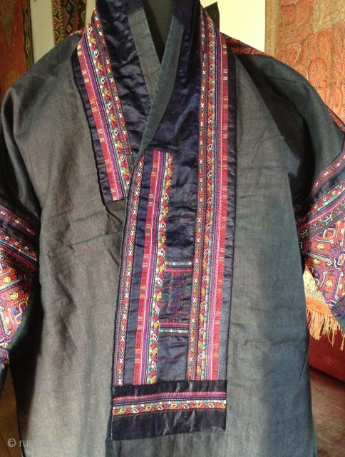 This is a jacket made by the Miao people, one of the largest minority groups in China.  It is an Indigo dyed cotton fabric which is very dark blue-black.  The  ...