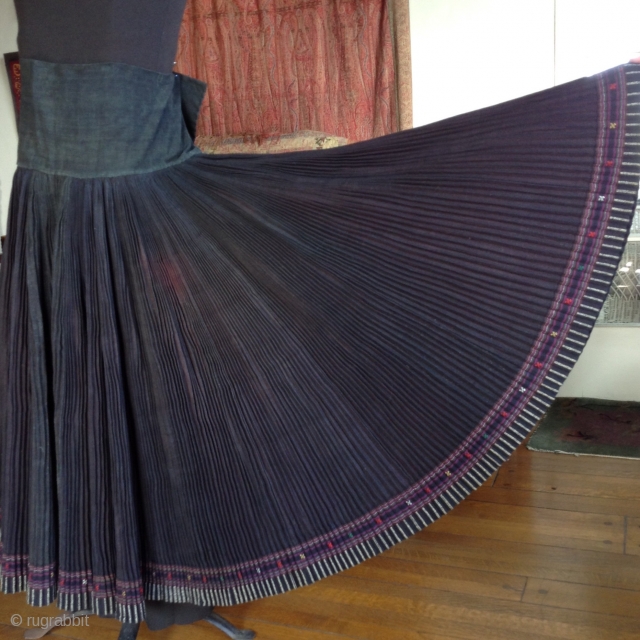 This is a skirt which wraps around the waist like an apron and makes a 360 degree circle when opened up. It was made by one of the minority groups in China  ...