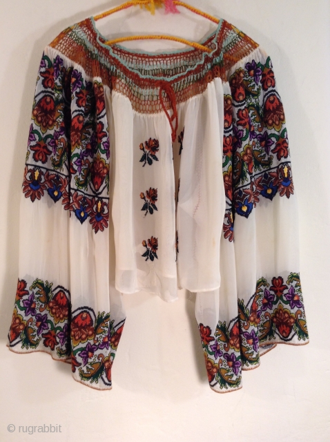 This is a very beautiful and rare Roumanian blouse made between the two Worild Wars in one specific village in Roumania.
The embroidery is extremely tiny and dense with black yarn used to  ...