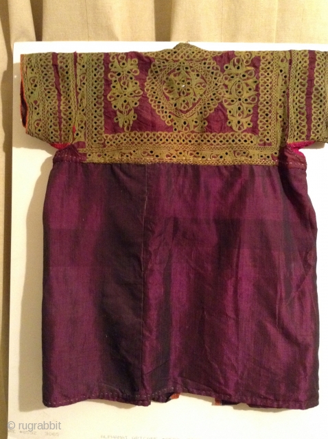 This is a beautiful little dress for about a 3 to 5 year old from India with very fine small mirror work on purple silk.  It is in great condition.   ...