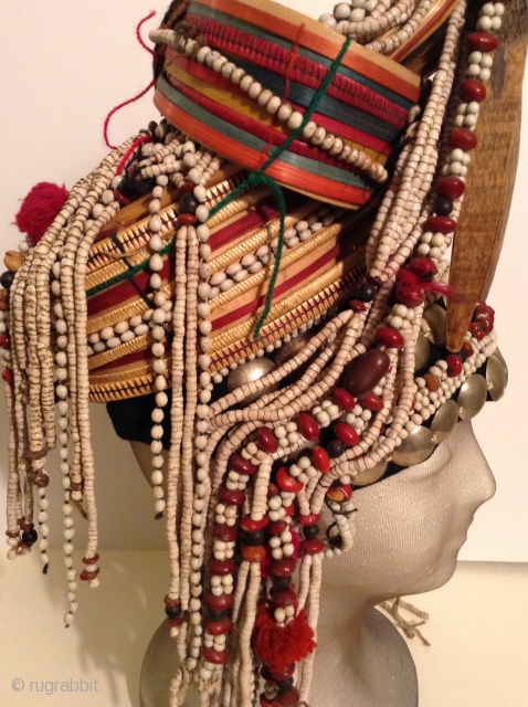 Akha Hilltribe Woman's Hat, either from Thailand or Burma. Woven Bamboo, rattan, seeds, metal beads, glass beads, shells, cotton.  18 inches long and 8 inches wide. Perfect condition.




.    