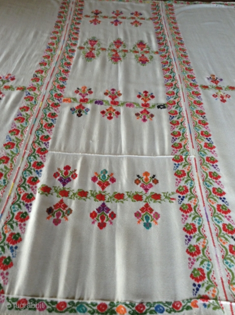 This is a  Palestinian wedding shawl.  It dates from about the early to mid 20th century.  The embroidery is a cross stitch and the colors are very vibrant as  ...